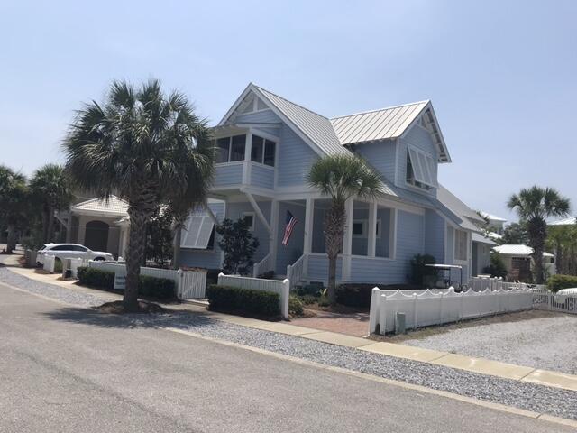 This house is a rare 4 bedroom, 4 bath home with two bedrooms and baths on the primary floor - the perfect vacation beach home, primary residence, or investment property.  The property is impeccably cared for and move-in ready - being sold furnished with a small exclusions list.  A large screened-in porch adjoining the living/dining/kitchen area creates the perfect spot for alfresco dining and relaxation.  Children's room with under eave play spaces is a favorite spot for hours of entertainment. Each bedroom has its own private porch.  The back yard of the home is a landscape paradise with luscious plantings, paved patio, outdoor kitchen, and fireplace.  Do not miss a great opportunity to own this lovely family beach house.