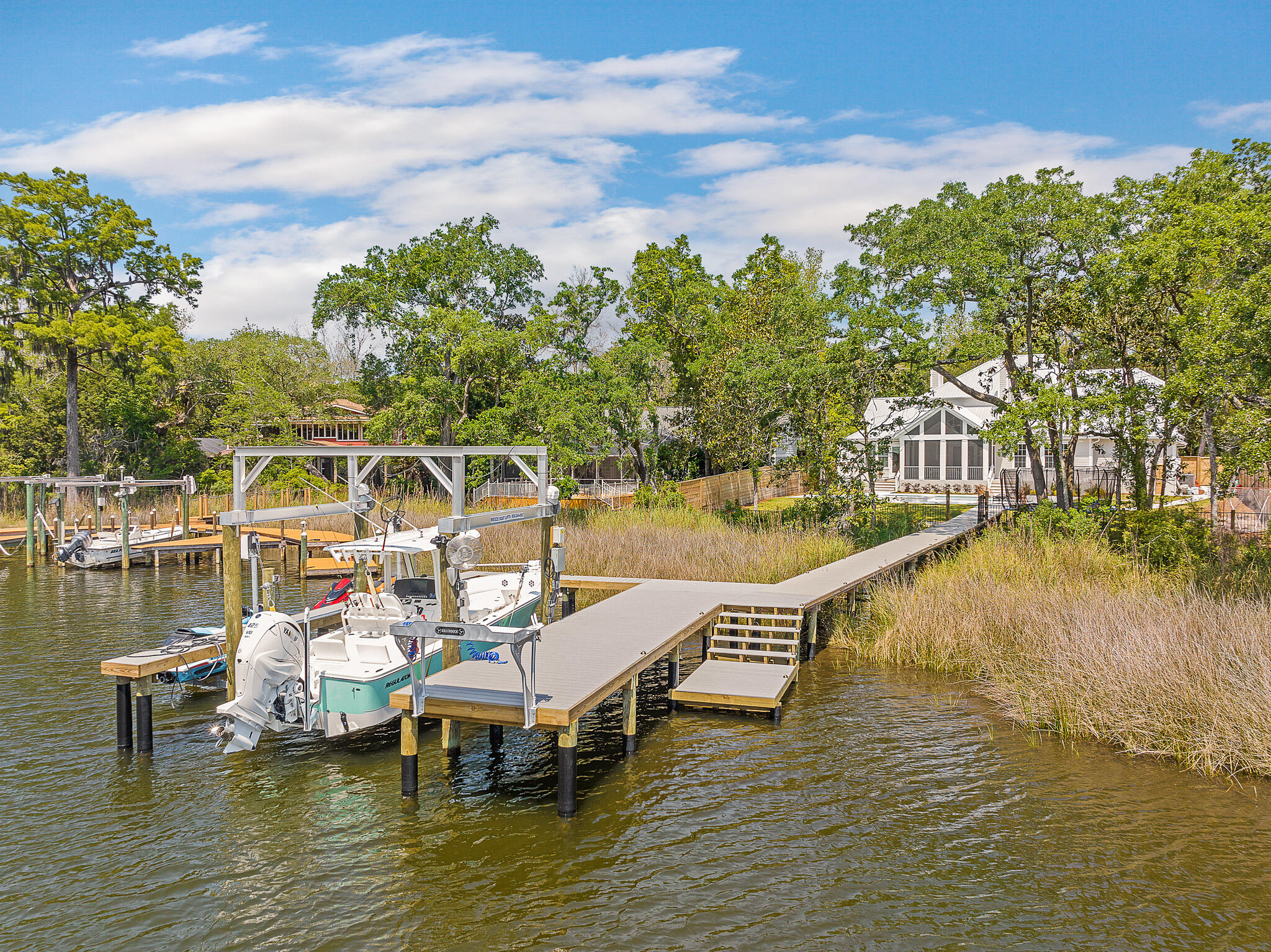 Boating and Entertainer's delight on private street with No HOA on a 1/2 acre of land located near Sandestin & minutes to 30a!This newly built home has 4br/4.5 baths plus bunk room on private street with sheltered water on the popular Choctawhatchee Bay. The large chef's kitchen features a 48''WOLF range, wet bar with built-in wine/bev. & ''Sonic'' style ice maker, an oversized quartz island and a giant butlers pantry. Home has 3 car garage, 3 fireplaces and a large screened in porch. The ground floor master suite features an oversized spa-like bathroom and overlooks the resort style hot tub and pool.Three additional bedrooms with en-suite baths plus bunk room, home gym/storage and media room are located on the second level.Brand new large dock with 16,000lb boat lift,