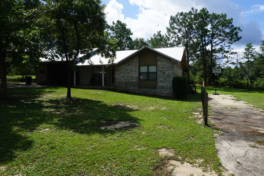 This all brick 2 bedroom 1.5 bath home is prefect for the first time homebuyer or for the persons looking to down size. Come enjoy your evenings on the screened in patio while you take in the sounds of nature. Home sits on just under 1 acre corner lot and offers tile in the bedrooms, kitchen and laundry room. Pergo wood flooring in the living room and hall. New master bedroom window, hot water heater and dishwasher. Call to schedule your showing today. You don't want to miss this one.