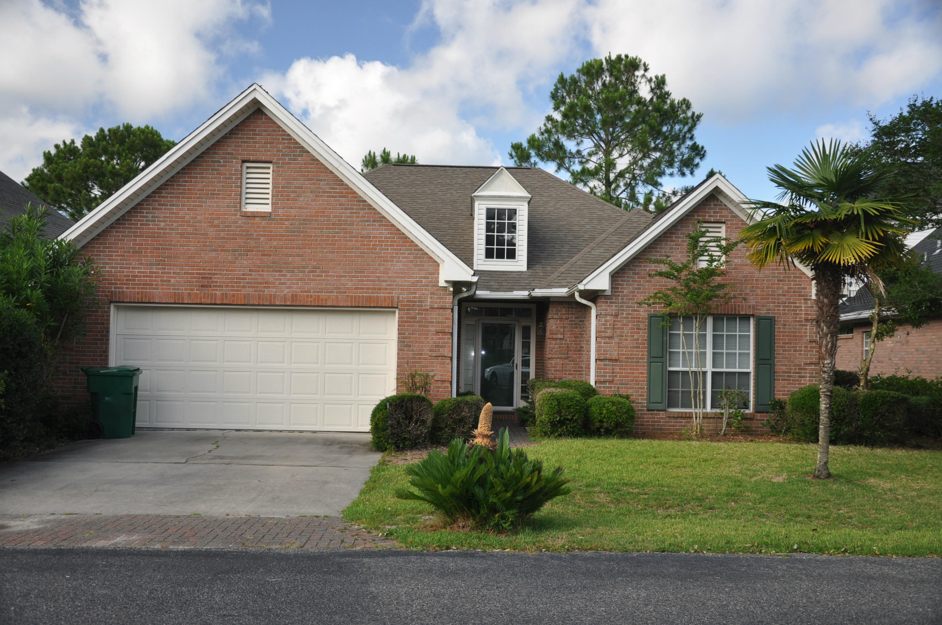 This brick home is located in Bluewater Bay a upscale residential community that has three 9 hole golf courses, a full service marina, four swimming pools, a championship tennis facility with 12 soft courts,and many jogging trails. This home has tall ceilings, wood floors, crown molding, granite counter tops, split bedroom design,and 9-10-and 14 ft ceilings. This home has new paint through out all the rooms and new tile in the laundry room. Everything is ready for you to move into this great home.