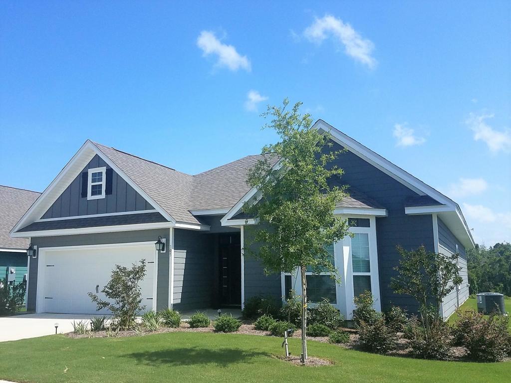 This beautiful 3 bedroom 2 bath home sits on a large corner homesite. Watch sunrise or sunset off the back porch which offers both a pond and preserve view. The incredible features of this home INCLUDE: granite countertops in the kitchen and both bathrooms, a large tile shower in the master with beautiful tile detail, upgraded extended pantry, wood-look plank tile in all main living areas and bathrooms with carpet in the bedrooms. The family rooms features a double tray ceiling with crown molding in both trays as well as crown molding in the foyer, kitchen, dining room and master bedrooms. The large master bedroom features a single tray ceiling with a sitting area.