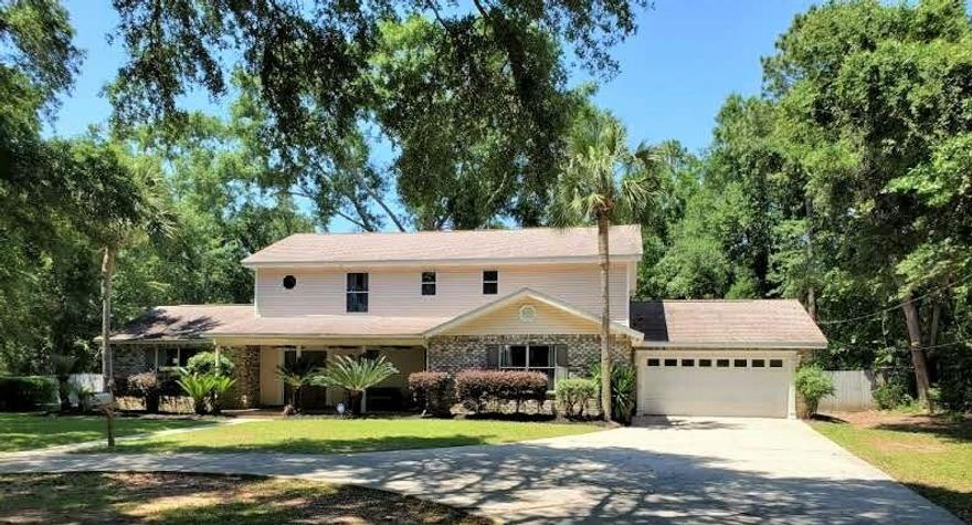 PRICE IMPROVEMENT!  BACK ON THE MARKET due to No Fault of the MOTIVATED Sellers!  You will fall in love with this picturesque 4 bedroom/3.5 bath pool home situated on a gorgeous, PRIVATE 1.07 acre lot in Cantonment!  You'll enjoy country living at its finest yet be close to everything 'city' and only minutes away from I-10's Exit 5 and the Nine Mile Corridor!   You'll enjoy a sense of serenity as soon as you pull into the large circular driveway with the home shielded from the street by mature trees and lush foliage!  A large front porch is the perfect place to sit and enjoy your front yard's scenery!  Upon entering the home, you are wowed by a 2 story foyer and a large living/dining space to the left.   The dining room affords a great view of the pool and the sliders allow easy access to