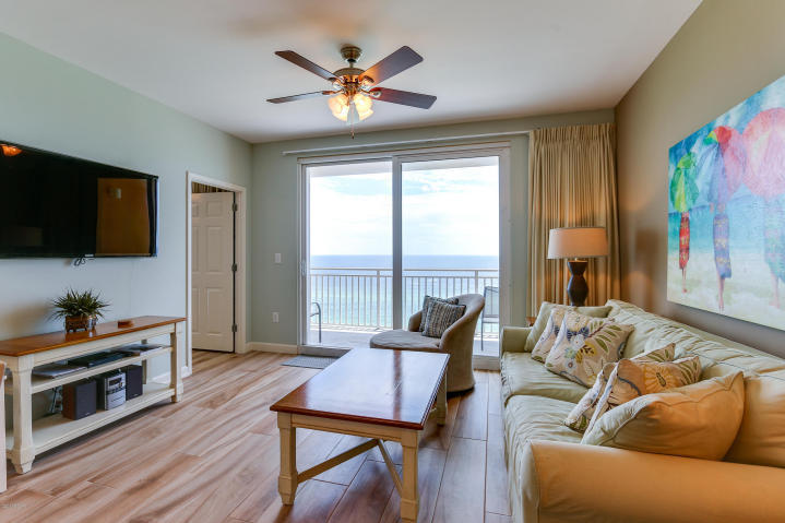 The best of the beach at Splash, located on the West end of the gorgeous beaches of Panama City. Hands down the nicest property in the development. This professionally decorated, freshly painted, Wave floor plan is in pristine condition and has been upgraded with new wood-look ceramic tile floor and new furnishings throughout. The condo features a gulf front master bedroom with balcony access and an open concept living/kitchen with balcony access as well. The custom walk in shower in the master suite and custom tile work in the guest bath really set this property apart. This unit is a POWERHOUSE RENTAL!! This prime 7th floor location is the ideal elevation in the stack which means more convenience and greater demand from a renters!