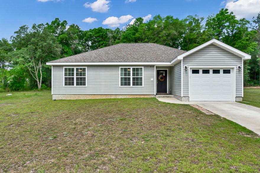 Welcome to your new home!  This charming property features 3 bedrooms, 2 full bathrooms, and an inviting open concept layout.  The entire home boasts beautiful vinyl tile flooring, offering durability and easy maintenance.  The kitchen is equipped with sleek quiet close cabinets and drawers, ensuring a peaceful cooking experience.  Spacious lot provides plenty of room for outdoor activities, gardening, or simply enjoying the fresh air.  Schedule your showing today!