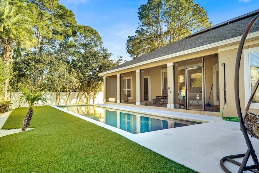 Welcome to your new oasis! This roomy 3-bedroom, 2-bathroom custom-built home with a bonus room has much to offer. Located on a quarter of an acre, house is in a NON-flood zone. The home is made for entertaining, beginning with the beautiful brick-paved driveway offering ample parking. The pool is equipped with a newer heating and cooling system for year-round swimming. The large back porch is screened and overlooks the fully fenced and manicured backyard. The backyard is very private and landscaped, including new astroturf, making it easy to maintain the aesthetic. Solar panels are paid in full, so no electricity bill! With vaulted 13-foot ceilings, lots of natural light, huge garage, and many other thoughtful features, don't miss out on seeing this beautiful home. Call today!