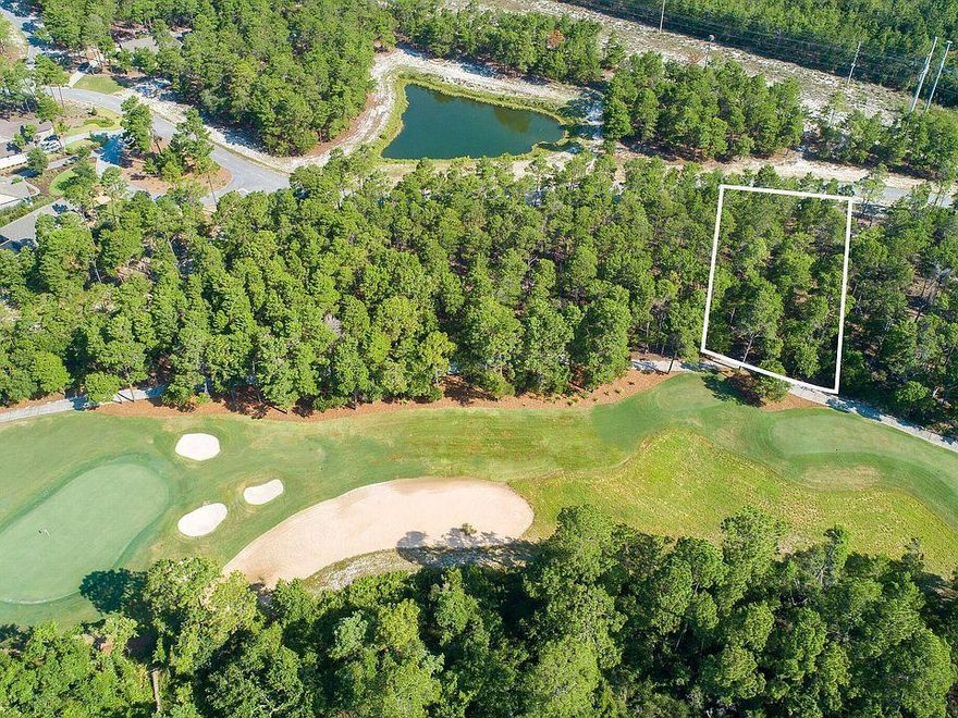 ONE OF THE LARGEST LOTS IN WILD HERON (LOST COVE LANE) BOASTING OVER A HALF ACRE! Great deal in Wild Heron! This 11th fairway lot is being offered for the low price of $85,000. Motivated seller, bring all offers! Golf Course Residential Lot on the beautiful 11th Fairway of Greg Norman's Sharks Tooth. Convenient to the Clubhouse, Pro Shop & Driving Range. Prospect Point is home to the lakeside Fitness Center, Pool/Hot Tub, Owners Library, Boardwalk, Fire Pit & Community Dock. The Boat House features canoes & kayaks for owner use on Lake Powell. There are membership opportunities available for Golf as well as the Watercolor Beach Club. Come experience the lifestyle that Wild Heron has to offer. You will find a true sense of community here.