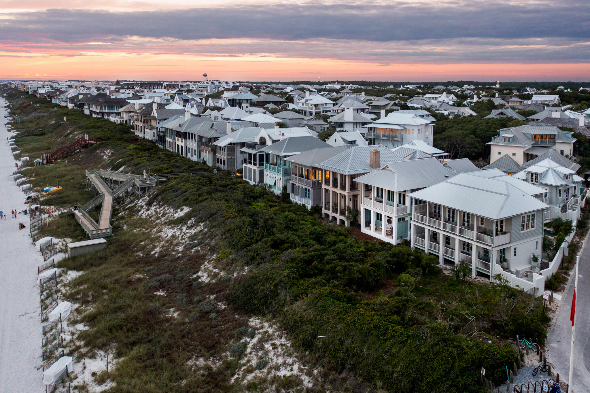 Welcome to your home in Rosemary Beach, where luxurious coastal living meets breathtaking Gulf-front views. This magnificent property has undergone a complete renovation, meticulously crafted and fully furnished by the renowned Ashley Gilbreath Interior Design. With its prime location, you'll enjoy unparalleled convenience and access to the best that 30A has to offer. Step outside your door and immerse yourself in the vibrant atmosphere as you take a leisurely stroll or bike ride to the finest restaurants and shopping destinations in the area.The main house boasts three bedrooms, 2 on the first level and one on the second, providing ample room for relaxation and privacy.