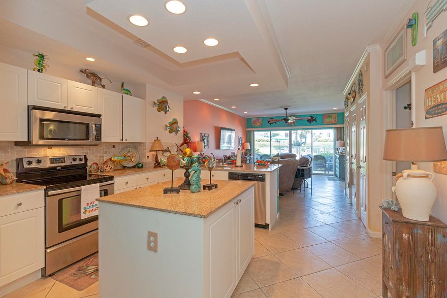 Bright & Beachy, this amazing 2BR/2BA, 1st floor condo is being offer furnished and ready for you. Just a short stroll to the beach and close to the community pool. As you enter this condo you are met with bright colors and amazing details. The kitchen features granite countertops, center island, breakfast bar, laundry closet and plenty of cabinet and counter space. The living room is large and opens to a covered patio. The master bedroom overlooks the swimming pool and has a private bath with jetted tub. There is also a second bedroom with access to the hallway full bath. Other features include owners closet, washer/dryer, & deeded beach access. Check out the virtual tour for a 3D virtual walkthrough of this unit. Buyer to verify square footage.