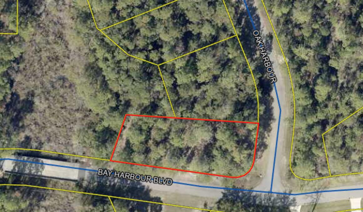 Welcome to a slice of heaven in Bay Harbour. A waterfront community platted with privacy in mind. Many walking paths, natural areas, water features, and beautiful landscaping accent the entire neighborhood. This corner lot has conservation on three sides allowing for ample amounts of privacy. Sprinkled with oaks and magnolias, this lot has the makings of a very special home. Bay Harbour is full of custom homes and amenities including a beautiful dock for fishing and enjoying sunsets on the bay, a private gated area to store an RV or boat, and a tennis court. HOA fees are only $600 per year. Lot has been partially cleared and tap fee are already partially paid. This lot is a must see to truly appreciate the beauty.
