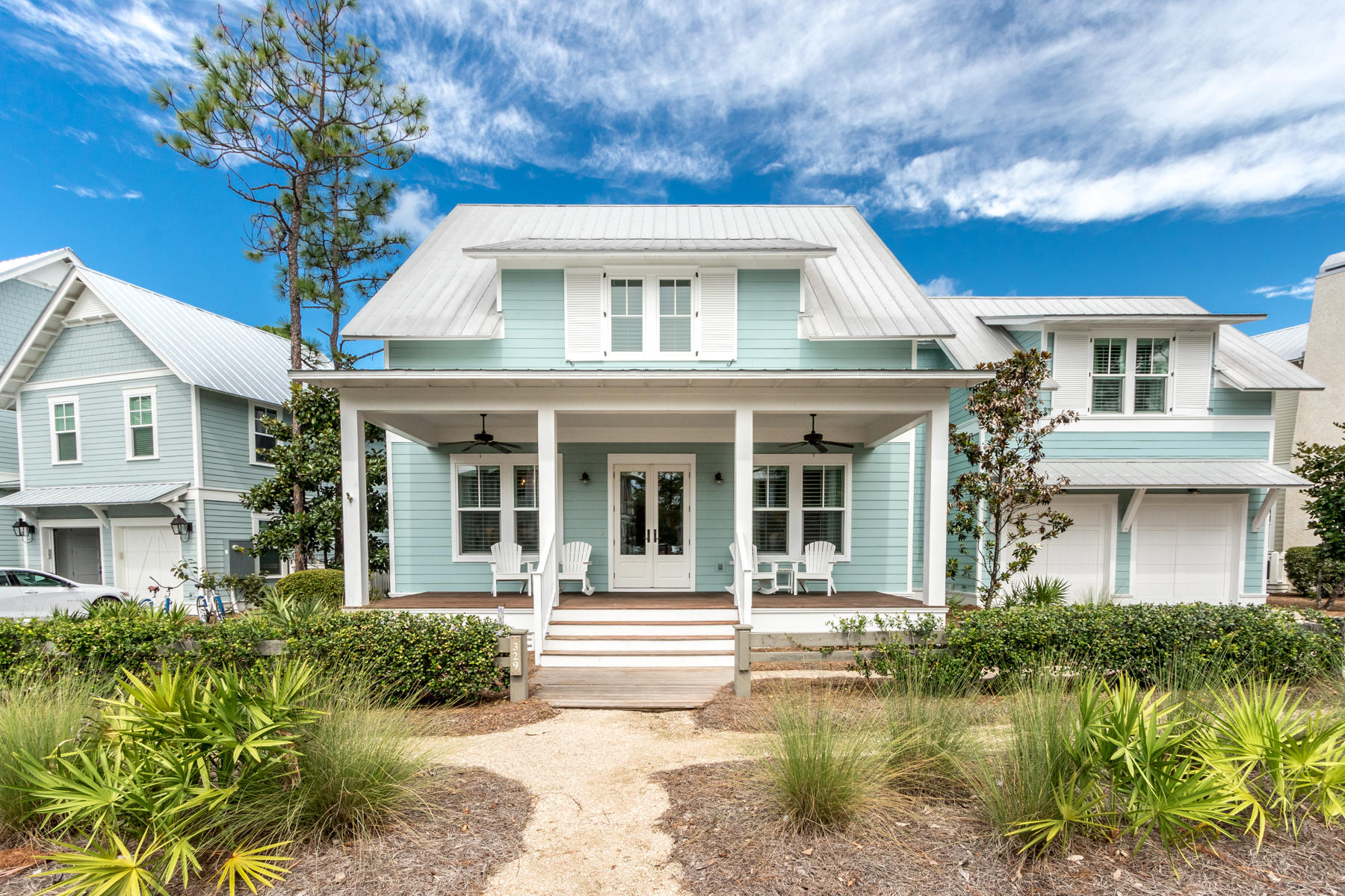 This lovely custom designed and built home is positioned in the Crossings District of WaterColor across from a small park and backs up to a beautifully wooded area. Upon entering you are greeted by detail that has been carefully planned and perfectly executed. The first level offers a spacious open living area that flows flawlessly into the kitchen and dining areas featuring Viking appliances and walnut floors throughout, a spacious master bedroom suite complemented by his and her walk-in closets and a back screened porch (with ipe decking) overlooking a wooded preserve. A second bedroom on the first level is currently being used as an office and there is also an oversized laundry area and powder room. On the second floor, you'll discover a large guest suite with a private bath, two...