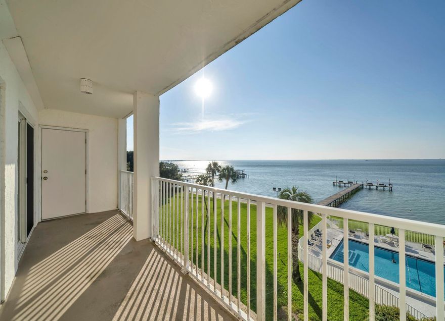 Incredible view from this 4th floor condo to enjoy sitting on the balcony for the evening Sunsets overlooking the pool and Dock. Only 2 bedroom available in complex. Great deal for direct waterfront unit. Sold as is. Needs $50-55k rehab. Value $500 fixed. Amenities include Tennis Courts, Beach Access, Fishing Dock, Shared workshop Community Pool and Center. boats can be docked but not stored.  Enjoy biking, Kayaking and enjoying the beach. 1 Pet allowed per unit. Last unit sold $500k same unit, fixed.