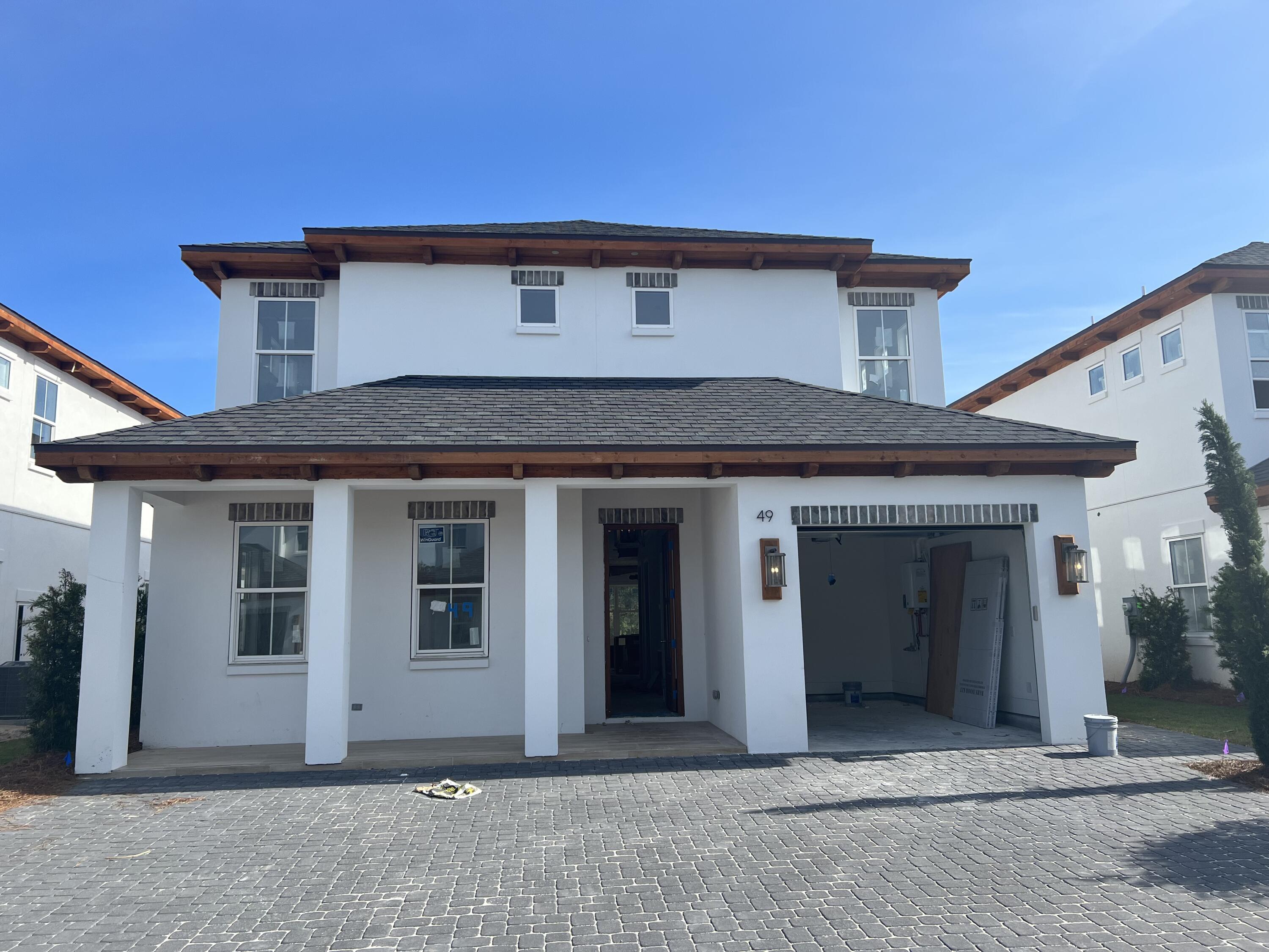 This beautiful New 4 bedroom house has tons of upgrades. 1 car garage, hardwood and tile floors, custom tile shower, standing soaker tub, shiplap on the walls, custom tile showers, 66in Fridge/Freezer, stainless steel appliances, Gas Navien tankless water heater. 2 Living rooms, Bunk Room , Fabulous Balcony. Private pool outdoor kitchen area. This is a 10 home subdivision just minutes away from the beach and near Gulf Place Center, great restaurants, shops, and golf.