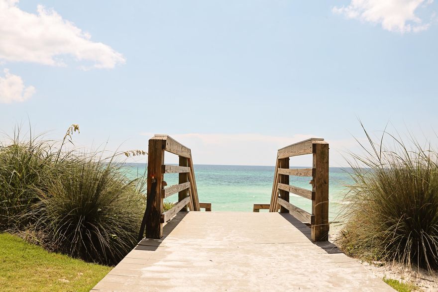 Located in Emerald Hill, this elegant, renovated corner unit offers gulf views from every room and is the only condo with four private balconies.  Steps to the beach, this 2 BR / 2.5 Bath condo with one car garage that also includes an owners closet for beach toys, etc.   The main level is an open concept design to a living room/dinning/kitchen  area with a custom bunk bed and two gulf view balconies with travertine floors throughout.