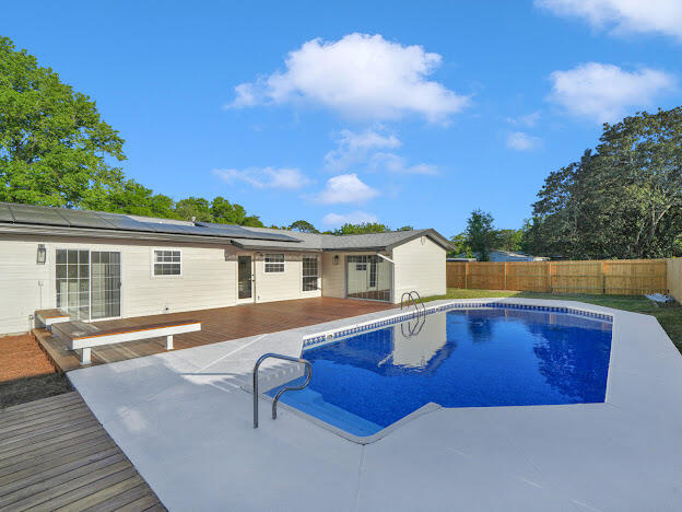 Introducing our latest project: a stunning pool home at 17 Oak Lane, Shalimar, Florida Come see this completely remodeled dream pool home in the charming community of Shalimar! Nestled within, you'll find an inviting inground swimming pool with a new liner, a pool house featuring a bath and kitchen, and a brand-new custom deck in the backyard. Additionally, recent upgrades include a 2021 roof and solar panels (paid off), ensuring both comfort and sustainability. 2017 AC, and upcoming additions like a 2024 gas hot water heater and complete rewire, this home is truly modernized for your convenience. Plus, enjoy the privacy offered by the new fence installed in 2024. Stay tuned for more updates, including professional photos showcasing every detail of this 100% updated home!