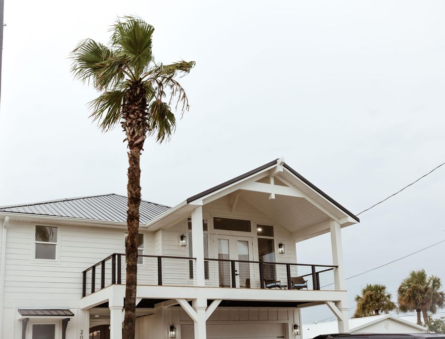 ''Casa Bella''...The Beautiful Home, located in prime Panama City Beach, Florida! This stunning new construction boasts spacious 5 bedrooms, 4 bathrooms. This luxurious home offers the perfect blend of modern and coastal elegance, right next to our beautiful Gulf extruding blue and green hues to gawk over, listen to the waves, and smell the salty air all from the Master Bedroom & Balcony. Not only does this home offer a wonderful location near all things Panama City Beach and 30A...it offers the ambiance of a full time residence, or part time residence with a Vacation Rental on the side. NO HOA or dues! As you enter the grand front door entry made out of mahogany wood, stained beautifully with pure craftsmanship. Upon entering this home, you'll enter a wide open space for you + your tribe to spread out with LVP all throughout the entire home for consistency. The kitchen island is crafted to match the mahogany on the front door, well thought out by the builder, and ties all details together wonderfully.

Furthermore, this home was built with wood and steel construction. The joist and columns holding up the house is made of steel, and will withstand 100 mph winds more than your standard house...which also means no termites because they don't like steel.

In addition to a well planned/thought out practical living area right off of the large kitchen + dining, the living space has an electric fireplace with a glow-like ambiance, which helps heat up the entire room during our short term winter months.

As you exit the living room to the backyard, you are greeted with a large private pool with palm tree's galore. Welcome to paradise! The most relaxing, enjoyable, and large space to enjoy a cocktail or a glass of cold ice water with your friends and family to entertain. 

The first floor holds 1 bedroom and 1 full bathroom (with a tub + shower combo, perfect for washing the small babies), and a large laundry room with a barn door. Underneath the custom cable railing stairs is additional storage which can be used as your own personal "Owners Closet".

As you enter the second floor, you'll find 3 bedrooms to the left, all with gulf views outlooking the windows. 2 out of 3 of the bedrooms to the left hold a jack + jill bathroom with another tub + shower combo, and the other bedroom holds it's own full bathroom with a decorated tiled shower.

To the right of the stairs is the oversized master bedroom with it's own LARGE balcony, 2 separate oversized closets, and a full bathroom professionally decorated with a gorgeous blue vanity, gold mirrors, with gold + black hardware and a stand alone tub. 

Just a 5 minute (or less) walk to our beautiful beaches, 6 miles to 30A, and 5 miles to Pier Park. Perfect location. Perfect home. See this for yourself - schedule a tour today to confirm all details are exactly as they are described and portrayed in the photos to experience this luxurious new construction home for yourself and live the Coastal Lifestyle.

Rental Projections up to $110K Annually.