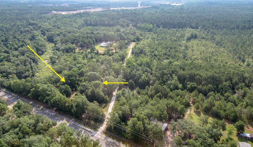 Five acre parcel for your ranchette with lots of privacy and mature trees and has frontage on small lake with stream that connects to Alaqua Bayou. This parcel has an old homestead (1930s) structure on it, but has no value. Close to downtown Freeport and convenient to the beaches, shopping and restaurants in South Walton and along 30A, you get the peaceful life and privacy only found once in a lifetime! Have a builder and plans ranging from 1955 SF at 455K build out to 3545 at 760K build out costs on top of lot price. Ask for details.Zoned rural village two units per acre. City water available and city sewer available.
