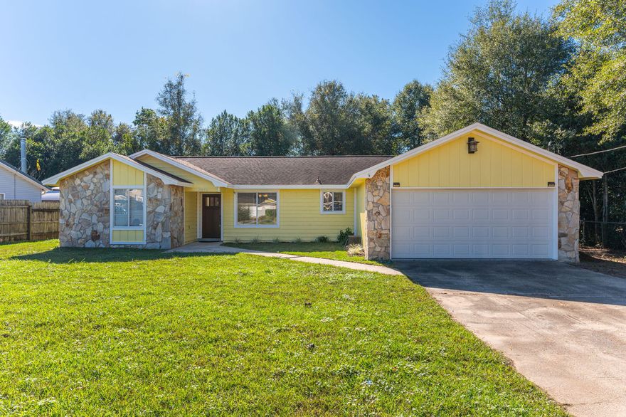 MOVE-IN READY! Check out this super cute home located in close proximity to town, but tucked away on a quiet street. Fresh exterior and interior paint w/ a beautiful epoxy finish on both the garage floor and front and rear porches. The beautiful stained front door is inviting and the home features a spacious living room with wood burning fireplace. Tile flooring throughout w/ the exception of the bedrooms which all have new carpeted. Nice bright white kitchen boasting granite countertops and stainless steel appliances including side by side refrigerator.  Nice master suite, lots of counter space on bathroom vanity - both master and guest bathrooms have granite. Nice covered rear porch and level backyard - perfect for relaxing and entertaining your guests.