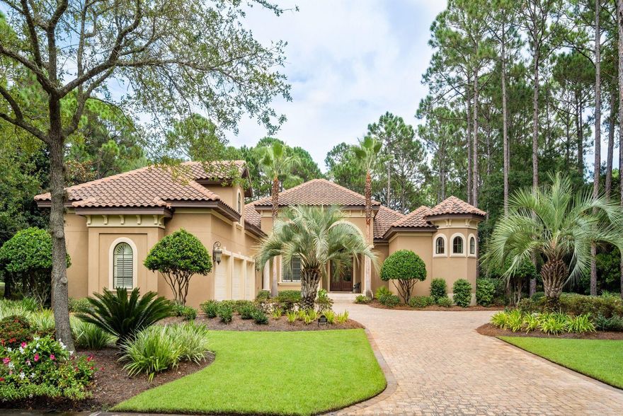 Few homes in the prestigious Burnt Pine community can come close to matching the jaw dropping views this property offers. Enter the front door and your eyes are captured by the sight of not one but two green fairway venues, a large lake with an illuminated fountain and then the Burnt Pine Club House in the distance. All that from the front door overlooking your own salt water pool and outdoor living area comfortably tucked into a wooded lot with lots of privacy. This beautiful and well maintained 5 bedroom, 5 bath custom home is a perfect balance of elegance and comfort. Built for entertaining, the living room opens onto a grand outdoor area with a saltwater pool, outdoor kitchen, fireplace, built-in TV cabinet, and ample seating and dining space.