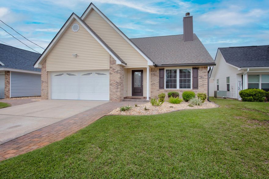 Looking for a great floorplan with a short commute to Hurlburt Field? Look no further! This ONE owner home is the definition of ''pride in ownership''. It is in immaculate condition and has thoughtful features from the kitchen down to the closets. Before you even step in the home you'll notice the recently power washed siding that is also wind rated, beautiful paver sidewalks, gutters, 80% sunblocking solar window screens and low maintenance landscaping. Upon entering the front door, you'll be impressed with all the space and natural light the home provides. The living room is a great size with wood burning fireplace and hidden cables for surround sound and cable. The kitchen was completely remodeled down to the drywall with a completely new, thoughtfully designed, usable layout. New ... custom Bishop cabinets with 42'' upper cabinets were installed, as well as custom lighting, Quartz countertops, touch control faucet, extra drink fridge, pop-up venting system in the island for the cooktop, water filter system for main refrigerator (located under sink), custom backsplash, appliances, tile flooring, stainless sink and extra outlets were installed throughout! Downstairs you'll also find the owner's bedroom, so you can live into retirement with this great set up. This suite has been outfitted with upgraded closet inserts, in-wall cable management and a TV mount. If that wasn't enough the bathroom was completely remodeled as well.  The bathroom now has custom Bishop cabinets, granite counters with dual vanities and medicine cabinets, a seat height toilet, marble shower with dual shower heads AND the bathroom window is hurricane rated! The additional bedrooms are all upstairs and have upgraded closet organizers and two rooms have in wall hidden tv cable wiring. The guest bathroom received a remodel with a granite countertop, Bishop cabinet, medicine cabinet, marble tub & shower, a seat height toilet and a hurricane rated window. The second floor is completed with a loft/flex area with engineered wood flooring. The home isn't complete yet, step into the garage where you will find commercial grade flooring for easy cleanup, Gladiator Gearwall(R) Panels ready for you to customize into the greatest of all man caves and two peg boards for even more tools and gadgets. The laundry area was also completely overhauled for ease of use. It now boasts more usable floor space as well as additional storage and a drying area. The beautiful backyard is now an epic entertaining area not only because it's gorgeous but also because of all the options to host guests. You'll find an almost 14' x 11.5' pergola that has a natural gas hookup and is wired for electric and lights and if the bugs are out you can gather in the 18' x 16.5' screened porch with custom concrete floor. **In addition to all these great features the windows, garage door, back sliding door and front door are all impact rated, vinyl siding has an additional 1/2 inch insulated board beneath it, gutters and facia were replaced in 2022, HVAC and roof were replaced in 2022. The home has a tankless water heater and all of the builder grade doors were replaced with solid core doors. All electrical outlets and light switches were upgraded as well as light fixtures and fans.** This home is truly a gem!