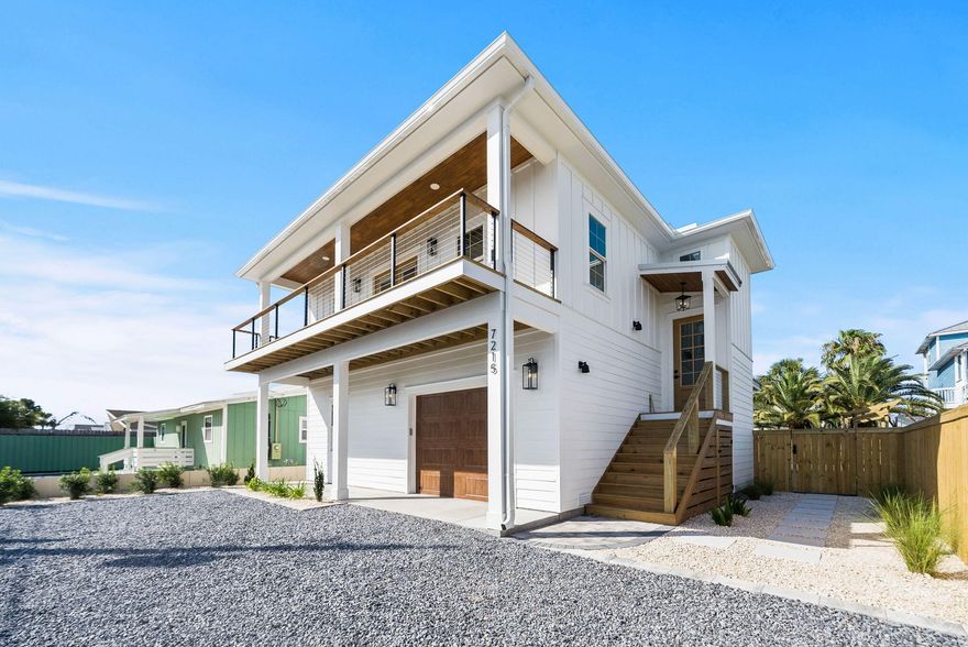 This is NOT your ordinary NEW CONSTRUCTION home in Panama City Beach, Florida...this is an exceptional custom home! Where an exquisite blend of modern, coastal design meets luxurious southern charm, this is an ideal choice for those who desire a higher level of elegance and return on investment. A testament to quality craftsmanship and meticulous attention to detail, there's truly nothing like it! Whether you are looking for an investment property with incredible returns, a luxurious second home or a primary residence like no other, 7215 Sunset Avenue offers unparalleled value and opportunity. You will NOT find custom features in a home like this with new construction! With no HOA, the lifestyle is what makes this home unique. There is ample space to park your boat or watercraft with an extended driveway, and public boat ramps just a few blocks awayoffering quick and easy access to the Gulf of America for snapper fishing, boating, and fun trips to stunning Shell Island, a breathtaking barrier island where the Bay meets the Gulf. Unlike the West end of Panama City Beach, this location on the East end provides unbeatable proximity to the Lagoon, Bay, and Gulf for the ultimate Florida lifestyle, just 2 blocks from the beach!

At just under 2,200 square feet, this home features 4 bedrooms, 3.5 baths, 1-car garage, and a back yard that is ready for entertaining! The exterior of the property is truly impressive, featuring a large fenced yard with pavers, a multi-use sports court for bocce ball and corn hole as well as multiple pergolas for lounging and grilling. The back yard is also designed with the potential for a pool to be included! Plumbing and electrical work for a pool are already complete, providing a seamless transition for future enhancements. This backyard is where the magic at the beach will happen providing ample space for a vacation rental or the perfect secondary home. The home is situated just two blocks from the renowned sugar-white sandy beaches, offering a most desirable location. It's also just a few blocks from Rick Seltzer Beach Park and many restaurants, shops and attractions. 

Upon entering, you are greeted by one of the best floorplans proven for vacation rental. This home features luxury vinyl plank flooring throughout ensuring durability and easy maintenance at the beach as well as high-level finishes and attention to detail you don't typically see in a new construction home. High end tile selections were thoughtfully-designed with modern, coastal wallpaper accents and paired with finishes like Quartz countertops and tongue and groove ceilings. The kitchen provides an open concept and you'll love the warmth the white oak cabinetry brings with the luxe matte LG Studio appliances and the sleek tiled backsplash with open shelving. The living area and dining area combine to create an excellent flow for entertaining while the French doors provide access to a covered patio with modern cable railing on a porch that spans the entire width of the home. You'll love sitting on the porch each morning with coffee before the day at the beach begins!

The lower level offers three bedrooms and two full baths and you'll love the unique built-in bunk beds in one of the bedrooms providing a cozy and fun place for the kids! The laundry is also on the lower level and across from an incredible storage area under the stairs, ideal for an owners closet should this be an investment property. On the upper level, you'll love the charming powder room just off the stairs landing and the primary suite offering a tongue and groove tray ceiling, custom built-in closet, modern white oak vanity with Taj Mahal Quartzite and a beautifully tiled Carrara marble shower.

The thoughtfully designed layout of this home maximizes space while also enhancing the home's rental potential at $86,000+ annually. Don't miss this opportunity to generate income in one of the fastest growing areas on Panama City Beach!