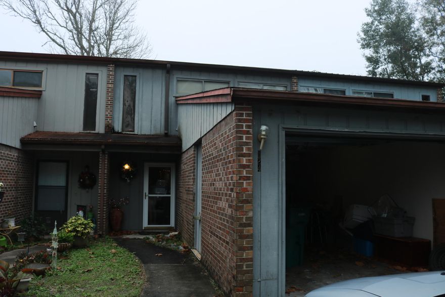 Excellent opportunity to own a 2 bedroom 1 full bath two story town home in Cinco Bayou in a quiet neighborhood with a Garage! Property appraised for $107K in October 2018. Unit needs some exterior woodrot repair, garage ceiling repair, & fogged windows replaced. Contemporary unit with fireplace. Open kitchen concept with vinyl flooring in kitchen and bath areas. Sliding doors from living room lead to privacy fenced back yard. Two parking spaces plus single car attached garage provides parking for 3 vehicles. Convenient to Eglin and Hurlburt Air Force bases. Schools, shopping, restaurants, white sandy beaches and Emerald Green water of Gulf of Mexico nearby! Buyer to verify all measurements. Sold AS IS.Property will only qualify for conventional financing.