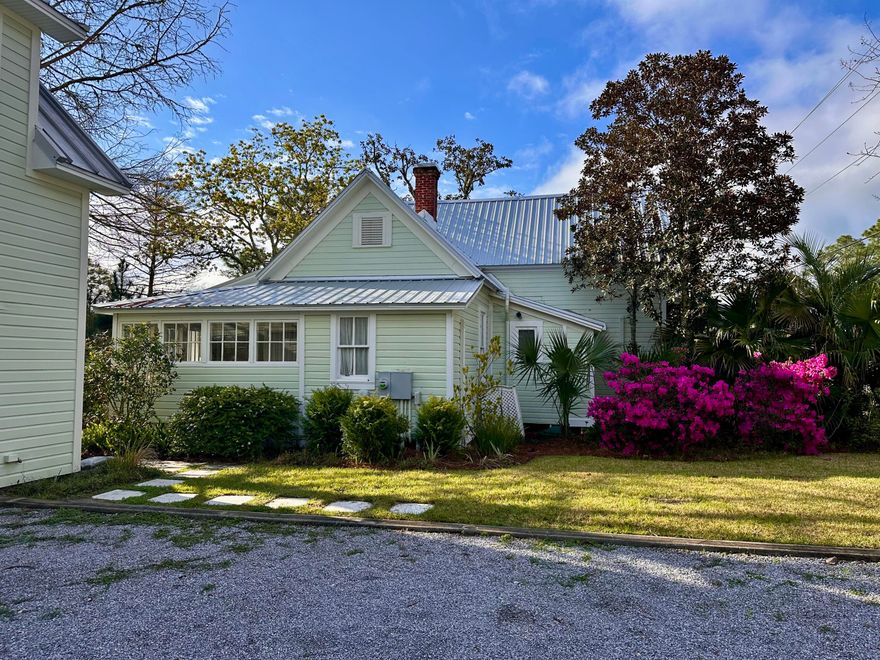 An original historic home built in 1922 in Santa Rosa Plantation is a piece of history.  This 2 bedroom, 2 bath charming home has an updated kitchen, downstairs and upstairs bathrooms.  Hardwood floor throughout most of first floor and second floor.  The character of the home takes you back in time, vintage tin ceiling in the dining area off the kitchen, most of the are original windows with wavy glass with some of them having plantation shutters. A new roof was installed in 7/2020. Porches off the first floor along the west and south side, a porch off the upstairs bdrm overlooking Cessna Landing & Mill Bayou. A detached one-car garage with a cottage apartment above was built in 2014 with a living area, kitchenette, full bath and office/guest room could be used for family and friends.