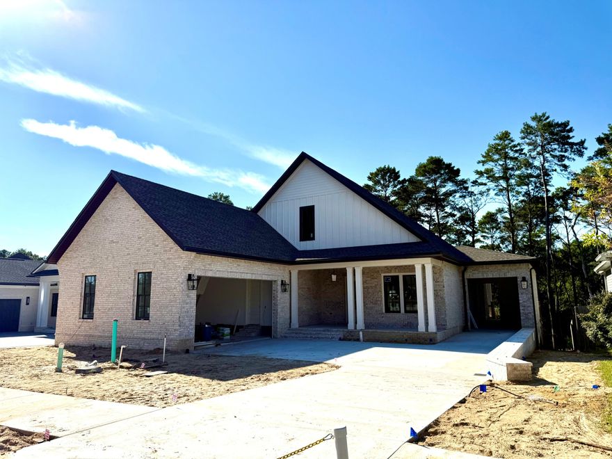 Stylish and luxurious new home, under construction in Ph 2 of Deer Moss Creek on a preserve lot, in Niceville. This 3 car garage home has it all. 1 main floor with a full  finished basement, below. 6 bedrooms, with the master and 2 guest bedrooms down and 3 more bedrooms on second level. and 4 1/2 bath.  As well as an office, 2 kitchens and 2 family rooms plus tons of storage rooms. High end finishes include engineer, hardwood floors, all wood cabinetry, quartz counter tops and large kitchen island.  2 walk out,  covered porches and deck, one on each  level, to view your lush, large yard on a perimeter lot . Plenty of room room for a pool and play space for kids and dogs!