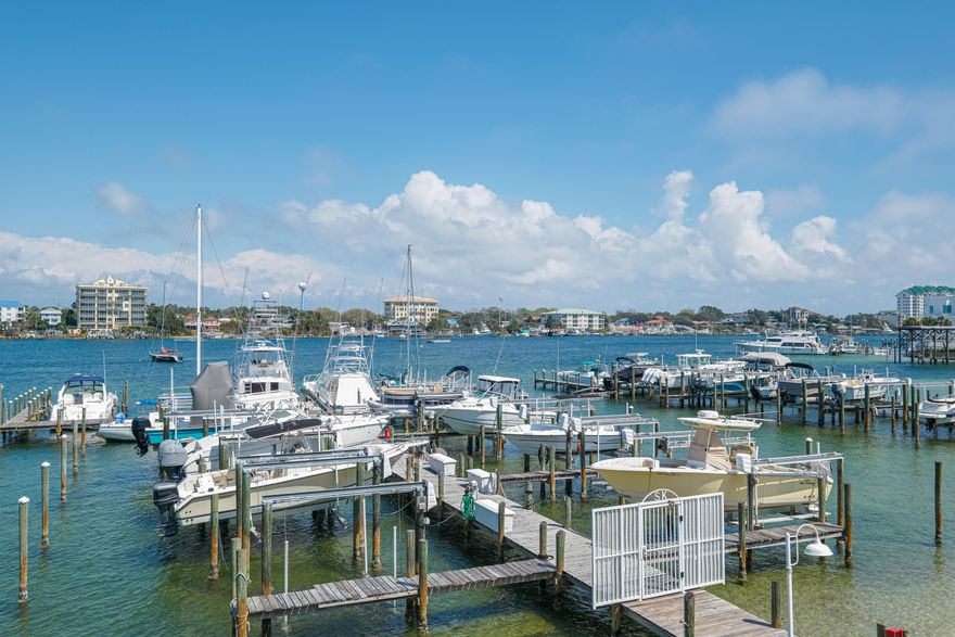 Enjoy the Destin boating lifestyle at Sun King Towers and Yacht Club, a gated twin tower complex directly on the harbor and canal that includes a private marina with available boat slips and easy beach access. Harbor and canal/pool view 2BD/2BA residence with recent renovations including new granite counters and gorgeous backsplash, new stainless appliances, totally renovated baths, tile floors throughout, recessed lighting, raised ceilings and more!  Amenities include harbor side pool, club house with kitchen, exercise room. Owner storage on first level. Well maintained complex was recently painted, new roof, resurfaced parking lot, upgraded elevators.  Two gated piers, fish cleaning station, commercial ice machine. Just minutes by boat to restaurants and Crab Island!