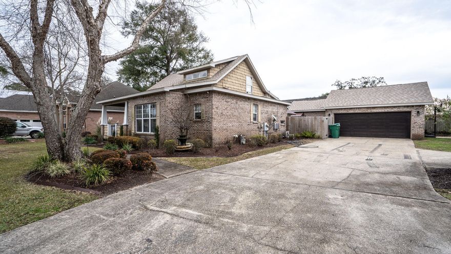 All brick custom-built home with many unique features. Classic front porch with craftsman style columns. Open floor plan and a fabulous great room with bayou views. Perfect for entertaining or just relaxing. Open kitchen & dining area with stainless steel appliances, gas range, large kitchen island and butler's pantry. Master bedroom has two walk-in closets with plenty of storage space. The other downstairs bedroom was originally designed as an office with a separate entrance.  Second floor bedroom has a private bath (great for guests) and balcony overlooking the great room. Custom interior features crown molding in dining room, built-in bookcases & columns, all adding to the Craftsman feel of the home.