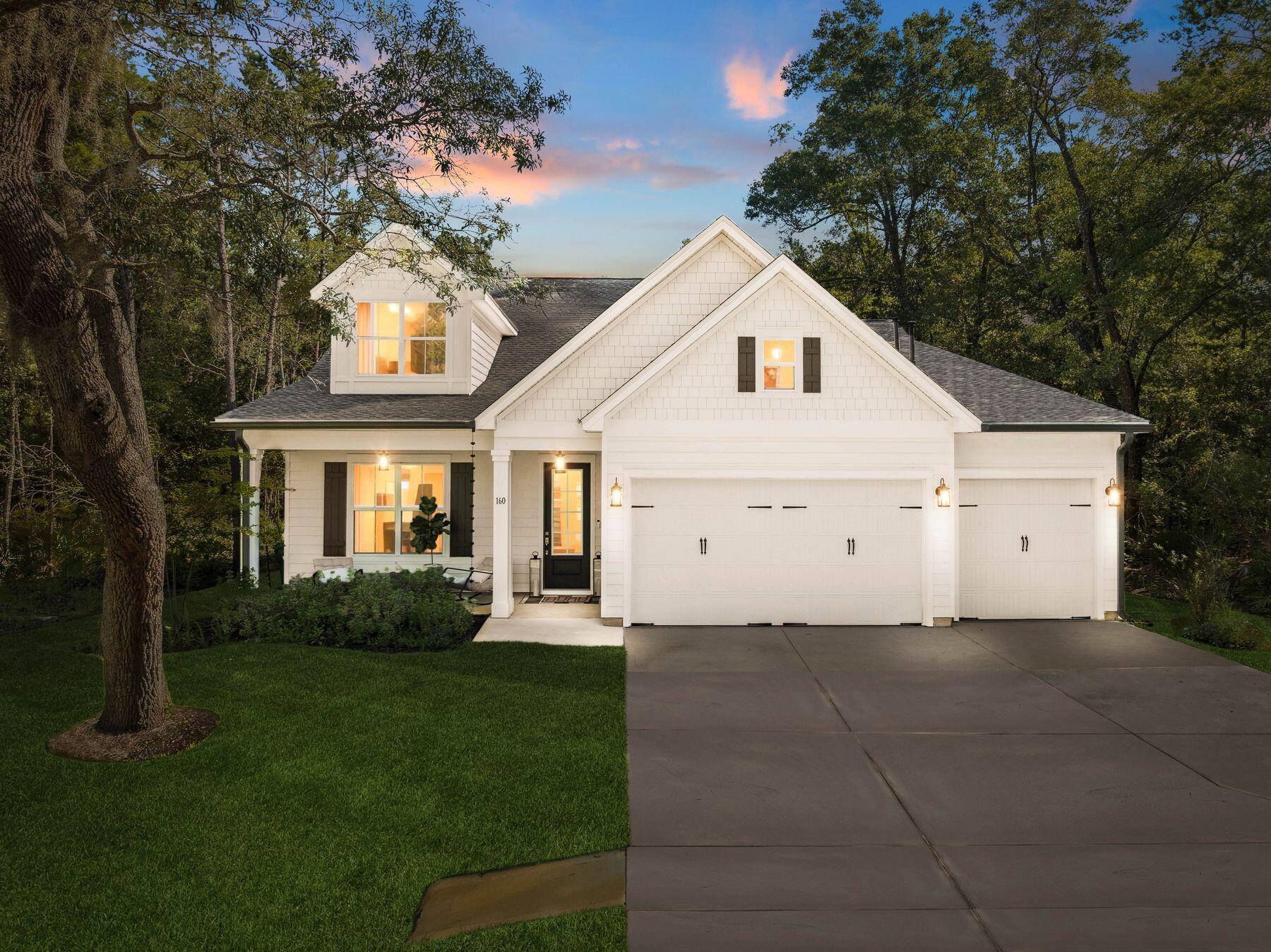 Built in 2024, this picture-perfect home is a gem. Nestled among mature trees and backing up to green space, it enjoys a serene, private location. The front yard has a broad driveway approaching a three-car garage and a shady covered porch. Showcasing a host of upgrades, this delightful Florida cottage is laid out all on one level with dormer windows in the roof providing added appeal. The spacious open living room has ample space for family life and entertaining, yet each designated area retains a cozy feel. The outstanding chef's kitchen is the hub of the home with premium maple bisque cabinetry and cool quartz countertops, providing a practical space to inspire any cook. A range of KitchenAid appliances and a mosaic tile backsplash add a touch of interest. The high-tech refrigerator, upgraded oven and microwave ensure it is as functional as it is beautiful. The well-positioned island makes it easy to create and serve meals while still being part of the conversation. Throughout this home, premium finishes combine designer touches with home comforts to create an enviable place to relax. Fully upgraded maple LVP flooring extends from the living room to all four bedrooms and their respective fitted closets. The dining area is crowned with a statement chandelier, while pendant lighting features above the kitchen island. As an added touch of class, a Midas touch of gold elevates the faucets in both the kitchen and the master bath. Four light, bright bedrooms and three bathrooms show as new with luxury fixtures extending to backlit LED mirrors in the bathrooms. Frameless glass shower doors, sleek floating vanities and a garden tub make every bathroom look like a lush ensuite. To ensure a good night's sleep, the home includes motorized blackout shades in the main room, and drapes and blackout curtains elsewhere. Storage is more than generous. Every bedroom and hallway includes closets, complemented by an additional laundry room closet. The generous garage is currently laid out with a custom closet and a workout area complete with gym flooring. There's still plenty of space for vehicles, bicycles and a golf cart. Step outdoors onto the furnished patio and enjoy the sounds of nature in the private green space. Kids have ample freedom to roam and play safely in this gated family-friendly community in the heart of Freeport. Those looking for a newer home on a tranquil lot will find all the hard work has already been done at this pristine residence, which is fully upgraded and move-in ready.