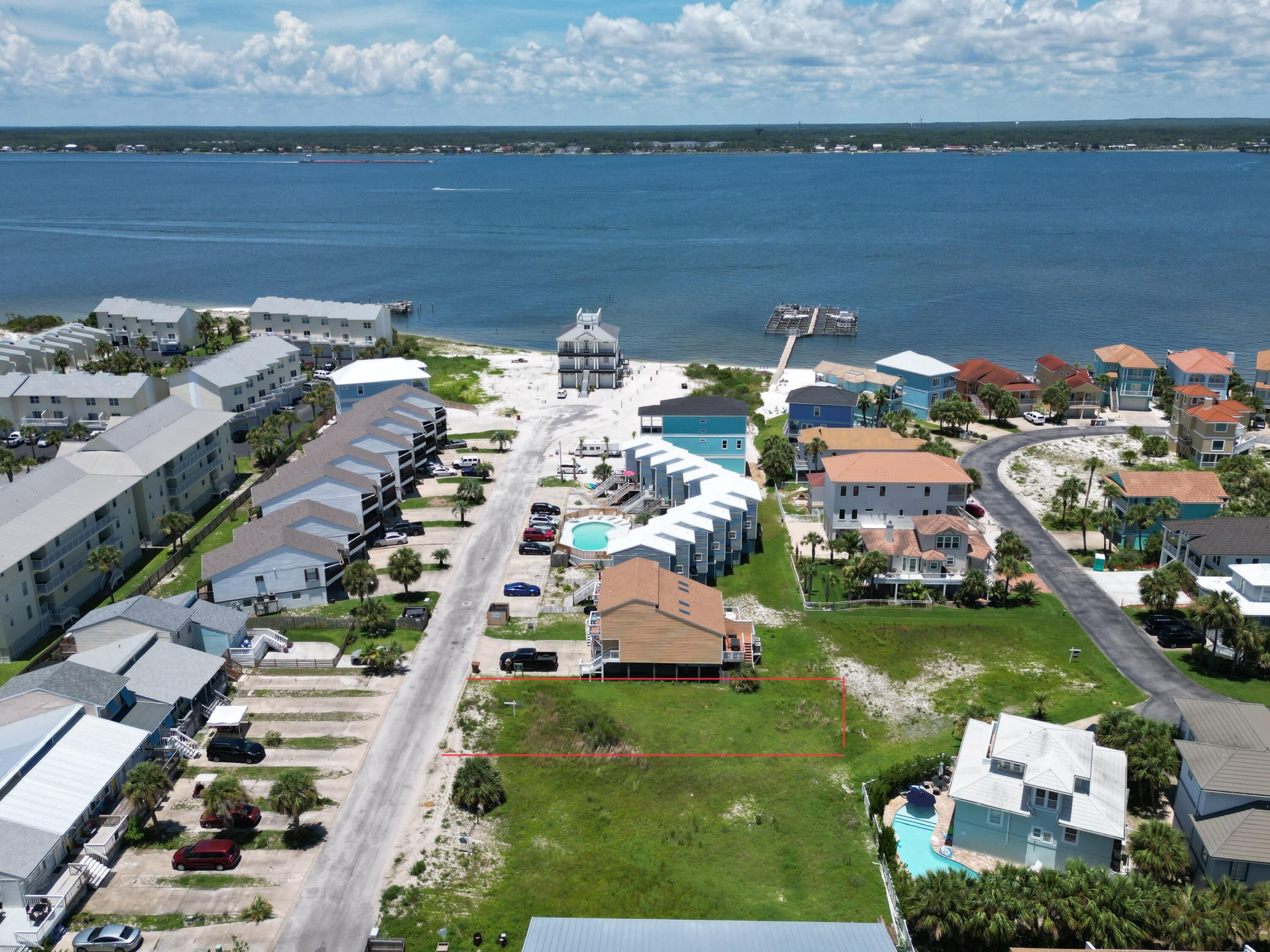 Nestled between Navarre Beach and the sound, a NBHD zoned lot which allows for residential or multi family dwelling. See documents for information provided from Santa Rosa County planning dept. An adjacent lot is also on the market giving a buyer an opportunity to build more residential / multi units. Seller is willing to pay for variance if buyer prefers setbacks to be changed. Flood Zone AE. Navarre Beach Water dept. Navarre Beach Sewer frontage 44 Depth 108