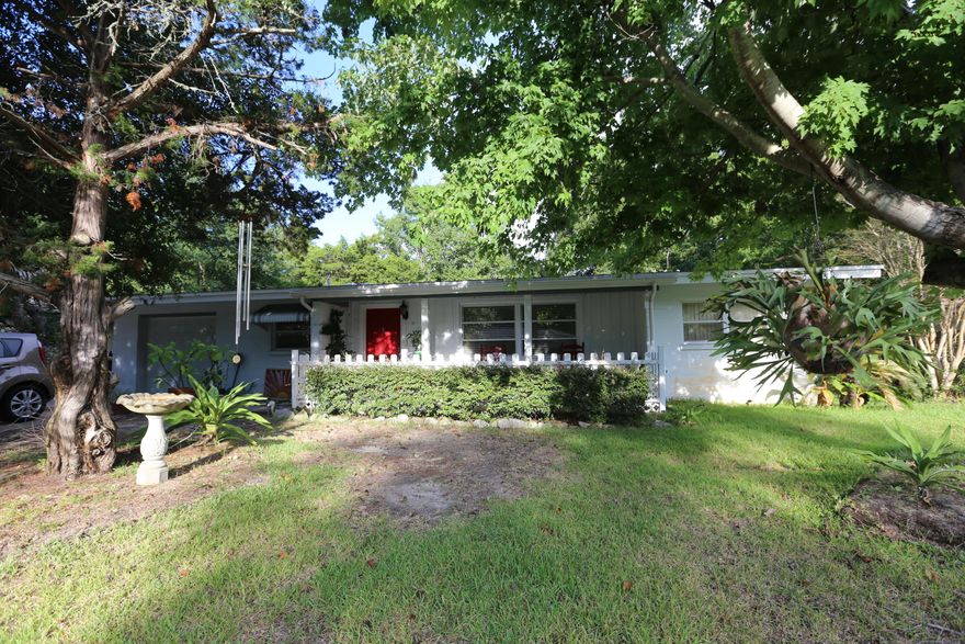 Brand new roof in 2015.Charming 4/3 Home in sought after Elliott Point neighborhood on nice quiet street. Concrete Block 4/3 with lots of extra room! Extra room/nook that would make a great office, play area or craft room. Gorgeous wood parquet floors in the living room and carpet in the bedrooms. Large Master Suite with His & Her Sinks and a walk in closet. Split floor plan with 3 other bedrooms on complete other side. Lush backyard with large shady oak trees, a workshop, Florida Room, Covered Porch and gardeners shed. Boat/Trailer Parking on the side + room for 6 cars in the driveway! Walking distance to a nice neighborhood playground and to the community boat ramp! 5 minute drive to the beach and a