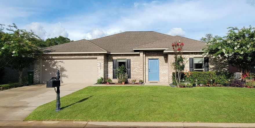 Turn key ready home located in South Crestview! This four bedroom 2 bath home has so much to offer with new paint, wired surround sound, and updated flooring. Walk into this open concept home with porcelain and beautiful tiled floors in all common and wet areas. Kitchen has stainless steel appliances with crown molding on cabinets, granite counter tops, and Santa Fe style doors throughout home. Living area has a separate bar that's perfect for hosting guest. New sod, shutters, and a freshly painted front door. Large master soak in tub with separate  tiled shower. Home has an exterior deck on back porch to enjoy your morning coffee or afternoon sunset. Sellers are offering a 1500 carpet allowance, and will replace the back door of the home with accepted offer!