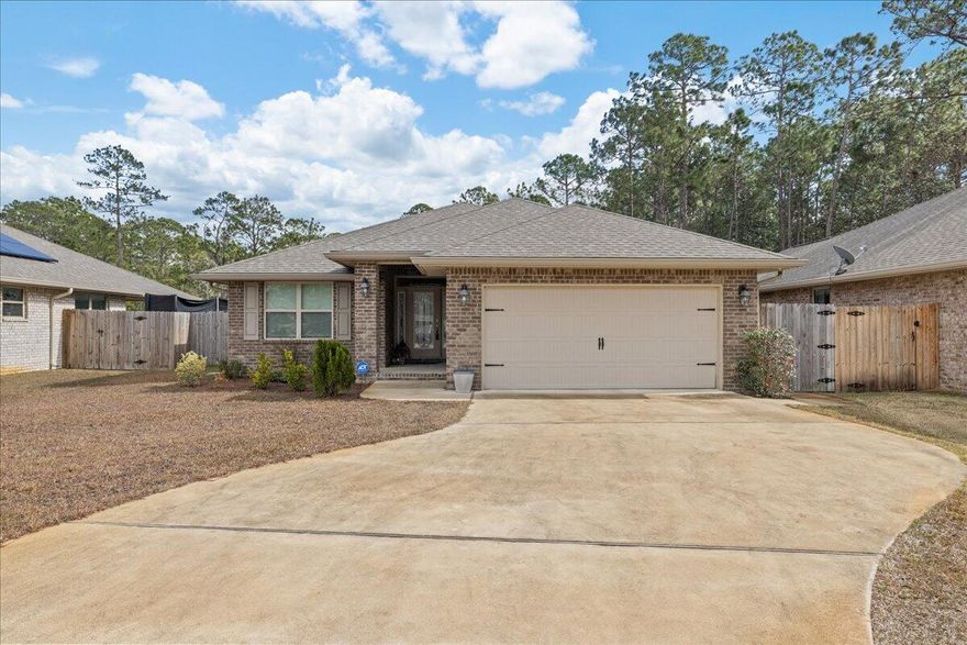 Welcome to the Sunset Pines in Gulf Breeze. This charming 4-bedroom, 2-bathroom home is tucked away on a quiet cul-de-sac street, ensuring a peaceful and private living experience.

As you step through the front door, the home opens into a spacious kitchen and dining area, perfect for entertaining. The kitchen offers granite countertops, ample counter and cabinet space to accommodate all your culinary needs. 

The home boasts four generously sized bedrooms, offering plenty of room for sleep, study, and storage. The master suite offers plenty of space as your private get away, complete with walk-in closet and spacious bathroom with a separate shower and a soaking garden tub. The front bedroom has a built-in double desk which can serve as a home office.

Outside, you'll find a covered back porch with space for outdoor dining and relaxing. The yard is fully fenced for privacy. 

Come see the charm of this home and its beautiful surroundings for yourself. Schedule your showing today!