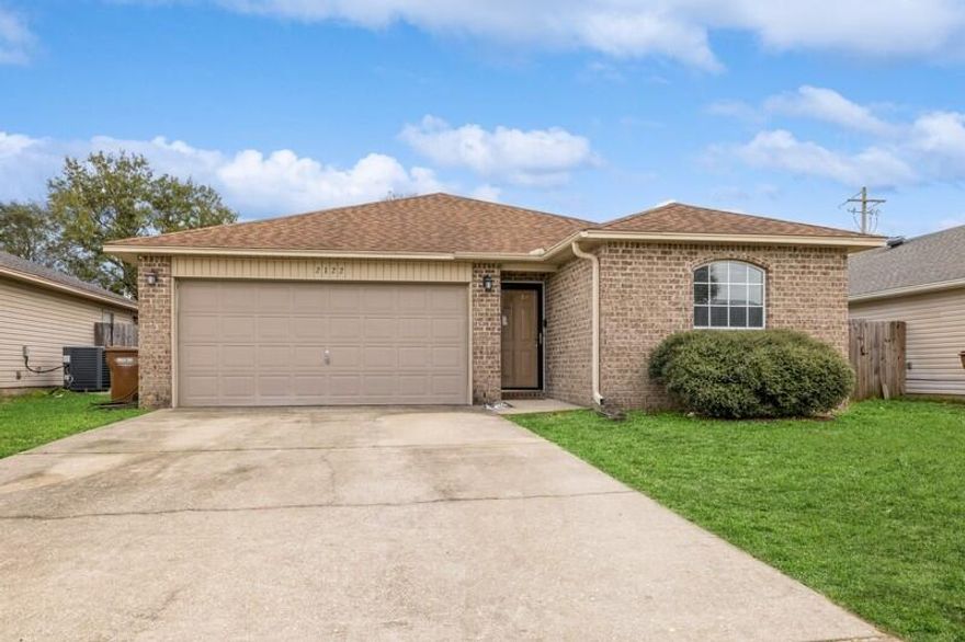 Discover your next home in this charming 3-bedroom, 2-bathroom residence, constructed in 2009, nestled within a cozy neighborhood in the center of Navarre. This heart of this home is its welcoming living room with vaulted ceilings, kitchen and both a formal dining room and a breakfast nook. Natural light floods in through sliding glass doors, leading to a private, fully enclosed backyard - perfect for tranquil relaxation and entertaining guests. Flooring throughout the home is a mix of laminate wood, vinyl, and plush carpet.Retreat to the spacious master suite, thoughtfully positioned at the rear of the home for added privacy. The ensuite features a garden tub, a generous walk-in closet, and a double vanity providing a peaceful sanctuary to unwind. 

Situated in the heart of Navarre, you'll enjoy easy access to the pristine beaches of Navarre Beach, shopping, dining, and military bases. Don't miss this opportunity to make this home yours. Schedule a private tour today!