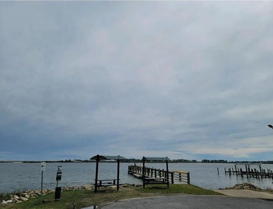 Nestled in Timberlane Estate of Mary Esther, this large vacant lot offers a rare opportunity to build your dream home on one of the last buildable lots in the neighborhood just steps from the water! Encompassing almost a third of an acre, the property includes a cement parking pad, power, water and sewer. This property is the perfect blend of privacy and convenience. Enjoy easy access to nearby amenities, including shopping, dining, and recreational facilities, while still relishing the tranquility and seclusion that this prime location offers. Don't forget the semi public dock at the end of the street with amazing  views of the water! The Lot is also very close to the local public schools.