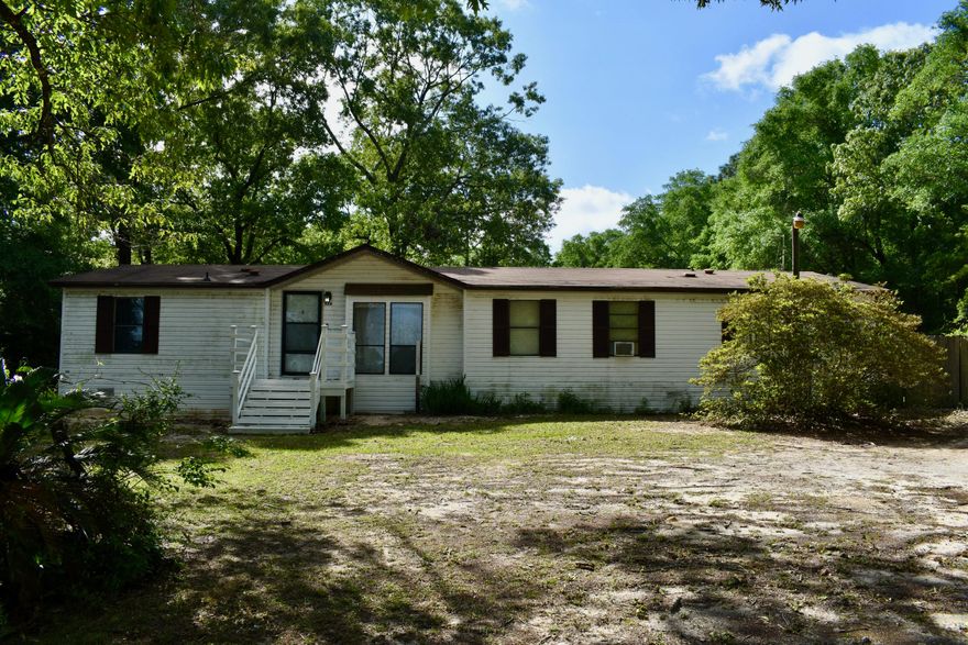 Escape to your own private oasis on 2.75 acres! This charming home comes with an extra lot, offering endless possibilities.

Outside, enjoy a private backyard with a pool and two sheds with electricity and A/C. 

Located in a peaceful area, this property offers tranquility and convenience.

Don't miss this opportunity! Schedule a showing today and make this dream home yours!