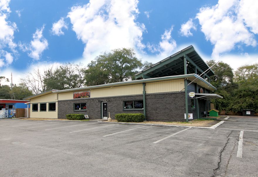 4670 sq foot building located in Fort Walton Beach on the corner of James Lee Road and Mayflower. This property is great for a restaurant! The building sits on .47 acres and features great parking. There is a fenced in back area with a patio and canopy. The interior of the building features a large open restaurant area, a large bar, smaller bar, kitchen, two restrooms, and an office. Buyer to verify all dimensions and information. Only the hood system, the refrigerator and freezer will convey. Owner financing available!
