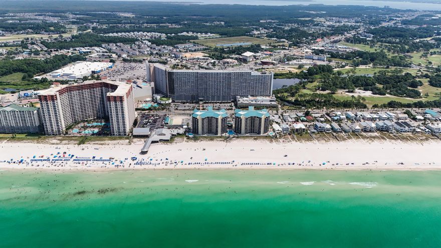 Remaining 2025 HOA fees being paid by seller at time of closing!!  Incredible Investment Opportunity!  This is as turn-key as it gets as this is being sold fully-furnished!  Everything you see in the photos convey including TVs/furniture/linens, etc.    1BR/2BA Lake-view condo at the beautiful Laketown Wharf Beach Resort.  This 1047 sqft unit offers spectacular lake views from the 1st floor, sitting right above the boardwalk.  Gross Rental Income 2021/$33,543, 2022/$27,882, 2023/$20,757, and 2024 $18,669 through August.  Rental projections are approximately $25-35k/annually. Step into the coastal ambience of this beautifully themed condo with touches of rich blues, whites, and creams. Your kitchen gives ample space to cook up that delicious meal as you return home from the emerald coast waters and white sugary sands of the PCB coast, all just a few minutes walk, with convenient access for Laketown Wharf guests. Your kitchen features white cabinets and granite countertops. Nestled close by you can relax on your couch or loveseat, overlooking the boardwalk and lake below.  Step outside to your private patio and be mesmerized each night by the fountain and light show dancing on the lake waters below, where restaurants and shopping line. 

Escape to your master suite with your ensuite master bath and soak your cares away in your personal tub. Master bath also includes dual vanities and shower/tub combo.  You'll find dual bunk beds right next to your guest bath, also featuring a tub/shower combo with one sink.  

This unit sleeps 4 comfortably but can accommodate up to 6 people so it's perfect for large families and entertaining.

Laketown Wharf Resort is in the heart of all the fun & excitement of Panama City Beach. Just steps away from the world's most beautiful white-sand beaches, shopping, dining and entertainment. Amenities include: convenient beach access, 5 unique pools, a kids fun-scape playground, Splash Bar & Grill, Gulf View Fitness Center & covered garage parking. Laketown Wharf Offers A Variety Of views Including The Gulf Of Mexico, Lake & Golf Course. Enjoy the nightly fountain & light show & market shops along the 52,000 sqft Of Lakefront Boardwalk.

