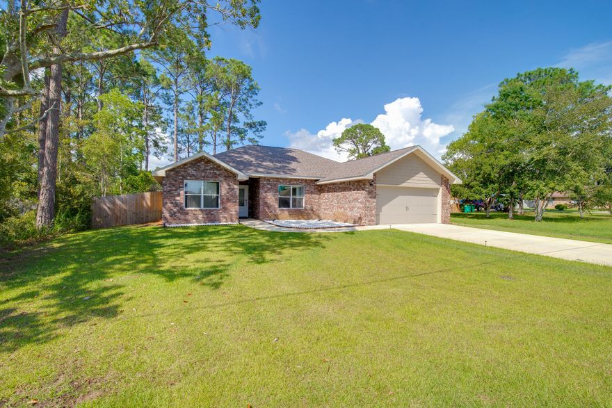4BR/2BA/2CG. All brick home in Mary Esther; West of Hurlburt Field AFB. Just built in 2019. KITCHEN: Granite counters, white shaker style cabinets w/soft close drawers, stainless steel appliances, and large pantry. MASTER BATH: Granite counters w/dual sinks, custom tiled shower w/seamless glass door, double shelved walk-in closet, and water closet. Tray ceiling in master bedroom and living area.   Vinyl wood plank floors in kitchen and living spaces. 12x24 tile in bathrooms. Carpet in bedrooms. Tall covered back porch overlooking a big backyard with privacy fence. Extras: Ceiling fans w/light, 2 panel doors, Hurricane Fabric protection, pull down attic stairs, 5-1/4'' Baseboards, Crown in 10 ft. areas, Flat textured ceilings, Low-E windows, lawn pump/sprinkler system, and termite bond