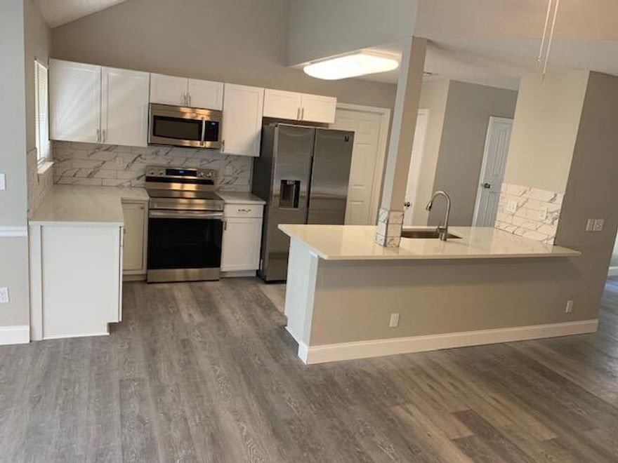 Open floor plan, tastefully renovated, craftsman style home.  This spacious home offers light pleasing colors sure to please your buyer. With new Quartz counter tops, undermount sink and all new matching Samsung appliances you can't go wrong.  Vinyl plank flooring compliments the finishes throughout the entire home. The bathrooms have a tiled shower in the master and a tiled tub surrounding in the second bath.  There is approximately 500 sf of heated and cooled loft storage space that is not included in the square footage above the living area and foyer area. Access is by way of pull down attic stairs. There is also a storage room along the back wall of the carport. There is also a good sized bonus room just off the master that can be used for an office, playroom or crafts.  Take a look.