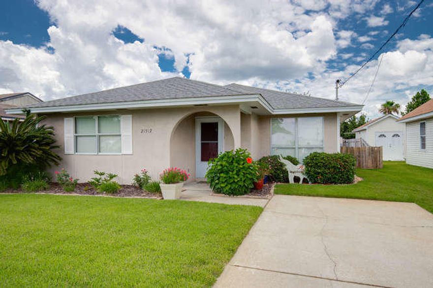 Just three blocks to the beach and close to everything. This 2 BR, 2.5 BTH home, with a bunk room, has been a much-loved family getaway for many years. The open living, dining and kitchen area are great for days when you want to hang out inside. Each bedroom has its own full bath, and the bunk room has a half bath for the kids. There is an attached storage room for your toys, and the golf cart shed will remain also. The back yard will accommodate a pool for your non-beach days. Attic insulated in 2012. New windows in 2014. New HVAC and exterior (elastomeric) paint in 2015.