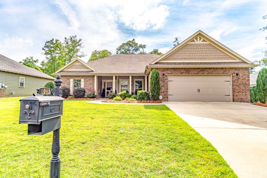 Better than new, SO MANY UPGARDES! Upgraded High Efficiency AC with smartphone control, Spray foam insulation, Real Oak Hardwood flooring, granite in Kitchen and all 3 bathrooms, Custom tile back splash, Custom Office built in with granite tops, stainless steel appliances, Screen enclosed Back porch with TV mount, tray ceilings and Curb appeal galore! Actually a 3 car garage as half of the garage is built to accommodate 2 cars deep, or use the extra depth for a workshop or workout area! This quality built home is packed with details, priced to sell, and is less than 5 minutes to the new Publix Shopping center, close to schools and easy commute to the area military bases. This one is a MUST SEE so call to schedule your viewing today!