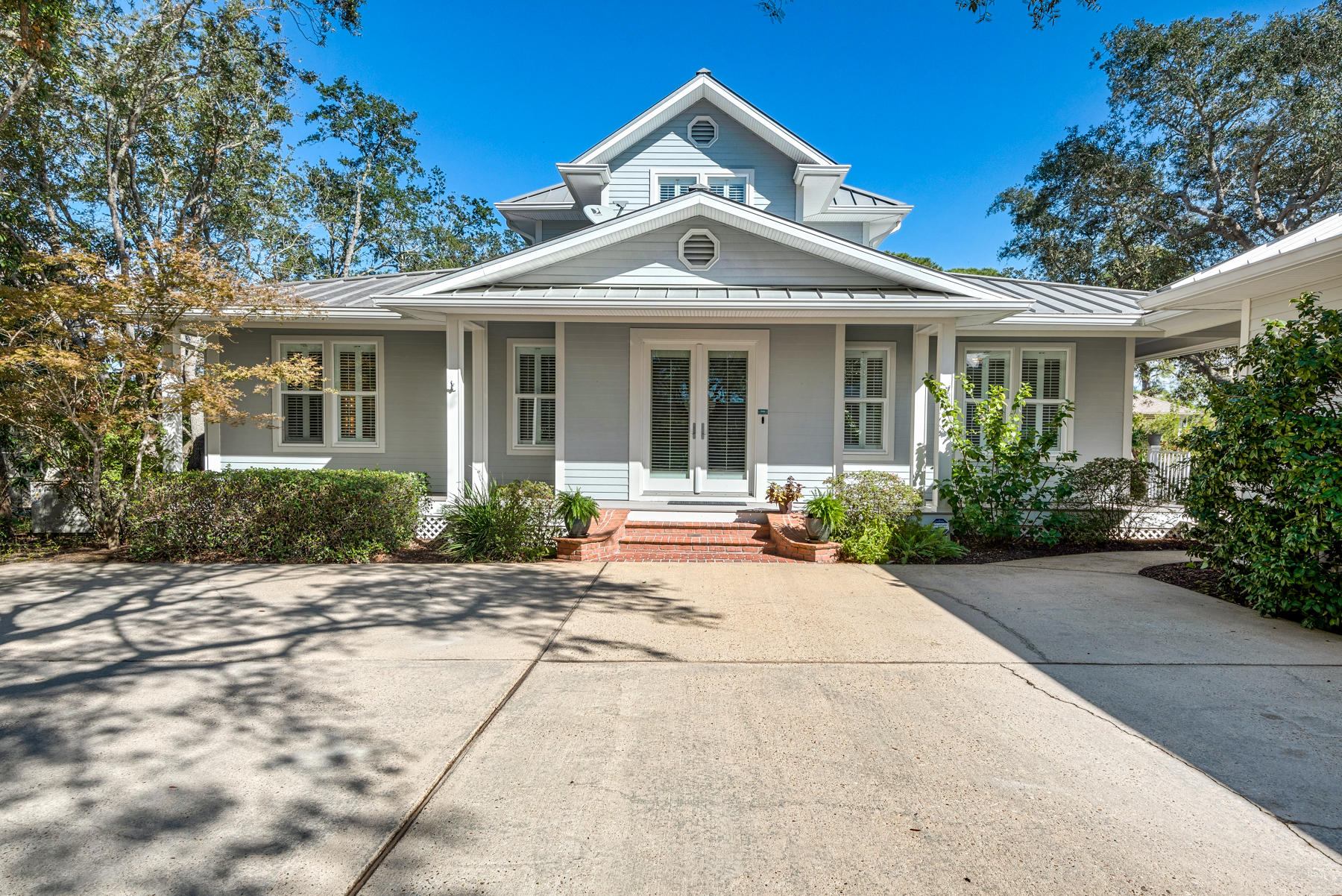 Welcome to 104 Indian Bayou! One of Destin's Privately Tucked away Deep Waterfront homes that are a rare find. This home welcomes you with one of the largest lots around where the Driveway is lined with Oak Trees that lead to this Breathtaking home that sits on an extremely large water front lot that sits on Indian Bayou in the heart of Destin. The main home has 3,200 sq ft and has been meticulously taken care of and has additional 1173 sq ft in the separate 3 car garage and is the perfect man cave or gaming area. Walk out to the pool on the back of the home with Lush Landscaping and sits on one Destin's Premier lots that has multiple Boat slips and will accommodate a 65' vessel and additional water toys galore. This home boast a whole house generator, tankless hot water heater, Plantation Shutters and so much more! The feel of this home is a welcoming Original Beach home and comfort galore. From Impressive Open Floor Plan, Gourmet Kitchen, Outdoor entertaining, Indoor Entertaining and the list goes on and on!