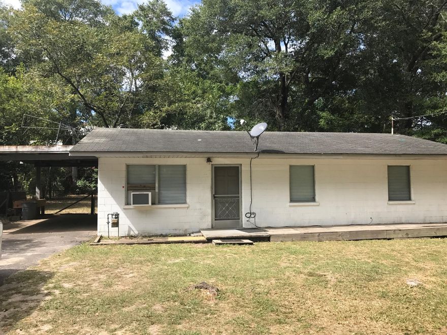 Investment home with 3 bedrooms and 1 full bath. Carpet in the bedrooms and living room. Large tile in the kitchen and tiled flooring in the bathroom. Fenced in backyard and a covered carport. Also available is the home next-door, both homes could be purchased for $105,000. Both homes are sold ''AS IS''.