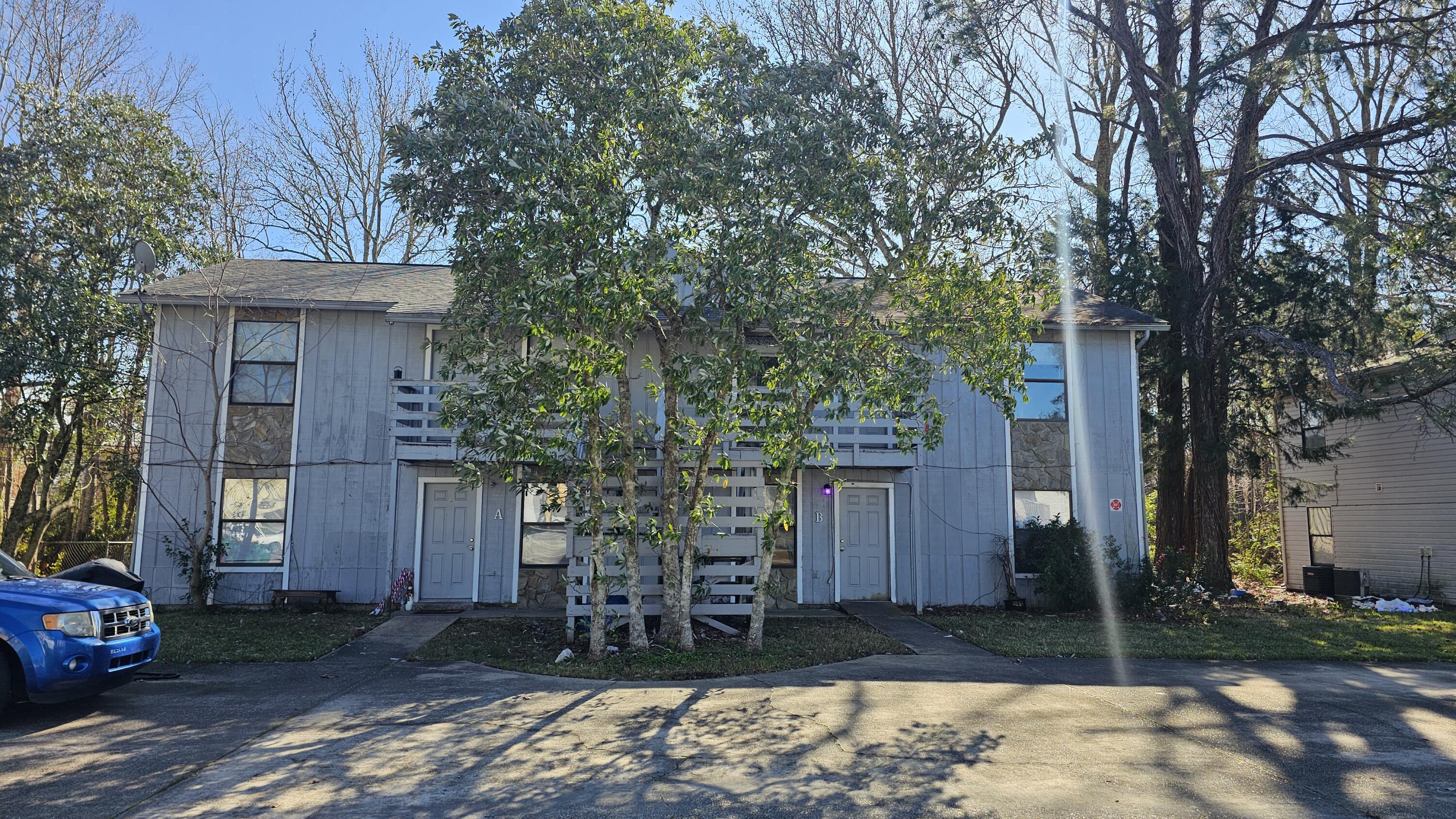 Nestled in the heart of Fort Walton Beach, this fourplex offers an exceptional opportunity with a total of 8 bedrooms and 4 bathrooms, split across four spacious units. Each unit boasts 2 bedrooms, 1 bath, and an efficient layout with 800 square feet of living space. Whether you're looking to expand your investment portfolio or seeking a home that can generate income, this property checks all the boxes! Rent averages at $1325 month. Tenants pay all utilities.Each unit is thoughtfully designed for convenience and functionality, featuring washer and dryer hookups, a private storage closet, and access to dedicated parking spaces--8 in total. Step inside to discover well-maintained interiors that make these units move-in ready. The galley-style kitchens, cozy living areas, and large windows ensure a bright and welcoming atmosphere.

The property's exterior includes mature trees and low-maintenance landscaping, complementing its charm and practicality. This multi-family gem also offers flexibility for future updates or customizations, ensuring it remains a valuable asset for years to come.

The unbeatable location places you close to everything that makes Fort Walton Beach specialshopping, dining, schools, and entertainment are all within easy reach. Plus, you're just a short drive from the stunning Emerald Coast beaches!

Whether you're an investor or someone seeking a unique living arrangement with income potential, this property is a rare find. Opportunities like this don't come along often, so act fast to secure this fourplex and start enjoying its benefits!