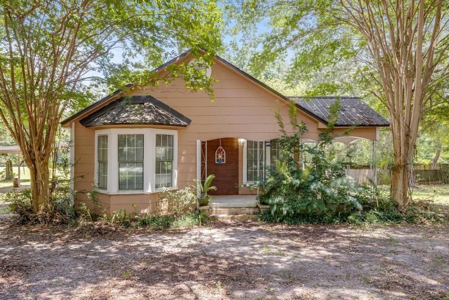 FINAL PRICE ADJUSTMENT for this now  'AS IS' Sale -Discover the charm of country living with this home nestled on a serene and inviting 1-ACRE LOT. Despite its peaceful surroundings, this home is conveniently located just minutes from downtown area of DeFuniak Springs. Step into the newly remodeled kitchen, where sleek granite countertops, Island, spacious sink, and all-new appliances complement the soft-close cabinets, making it a perfect space for culinary adventures. The home has been freshly painted and features stylish laminate flooring throughout, enhancing its bright and welcoming atmosphere. Both bathrooms have been tastefully updated with new toilets and vanities.  Metal Roof (2015) and a self-contained AC system (2023) , ensuring durability and year-round comfort. (con't) A large workshop on the property provides ample space for storage or any special projects you might have in mind. This charming country home offers a perfect blend of tranquility and modern convenience, making it an ideal retreat for those seeking a peaceful lifestyle.