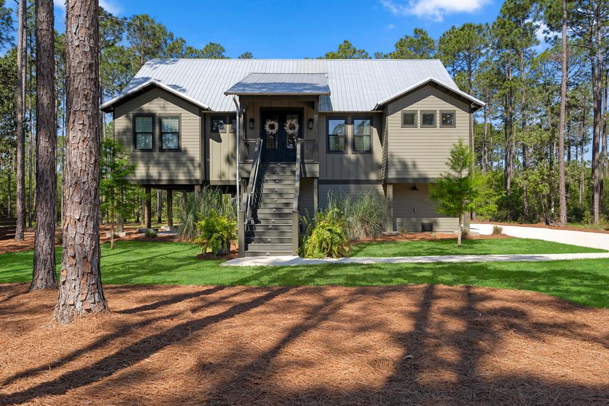his beautifully built 4-bedroom, 3-bath home is nestled in the desirable community of RiverCamps on Crooked Creek. With its many custom features and open-concept design, this home offers a luxurious and inviting living experience. As you step through the 8-foot doors, you'll be greeted by the spaciousness provided by the 9-foot ceilings that span throughout the main floor, creating an airy and light-filled ambiance. The heart of this home is the chef's kitchen, which boasts fantasy gray countertops, a custom tile backsplash, and top-of-the-line appliances. Prepare gourmet meals with ease using the 48-inch gas stove with two electric ovens, and store your favorite wines in the convenient wine cooler. The large laundry room includes a service area, providing added convenience. Relax and unwind in the large screened porch, complete with a gas fireplace and a dedicated grill area, perfect for entertaining guests or enjoying outdoor meals with family and friends. Additionally, the master bedroom features a private deck with a cargo lift, offering a tranquil space to enjoy your morning coffee. With two spacious living rooms, there's plenty of space for everyone to gather and relax. The master bathroom is a true oasis, featuring a two-sink vanity, a large soaking tub, and a separate shower. The house is equipped with a Renai instant gas hot water system, ensuring a constant supply of hot water throughout the home. Owners finished out the third floor post construction with many upgrades throughout the home. Whether you need space for your hobbies or simply want to keep your belongings organized, this home has you covered with an abundance of storage space. This home truly offers a lifestyle of luxury and comfort. Custom Built Bunks & Transferrable 4-Year Home Warranty Included. Schedule your private showing today!