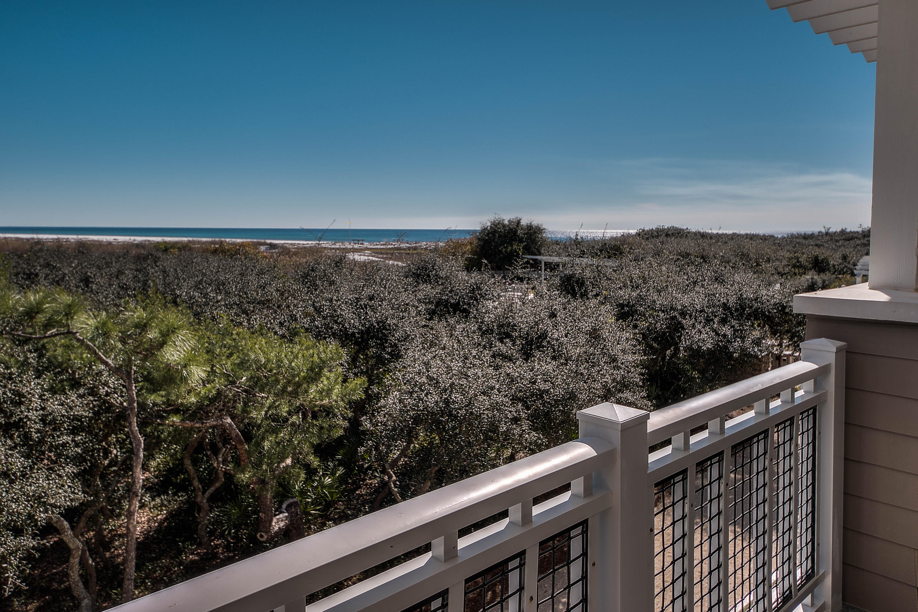 A rare gem in WaterSound Beach! This Gulf front condo is located on the corner of the Compass Point II building allowing for a multitude of natural light and privacy. Porches on both levels showcase the expansive views of the mile of private beachfront and dunes. A single attached garage, laundry, office and three guest bedrooms with their own ensuite bathrooms are on the ground level. Upstairs are the open living and dining areas, kitchen complete with Viking appliances, breakfast nook and the powder room. The master retreat is extremely spacious and the luxurious bathroom includes a soaking tub, separate shower and two walk-in closets. Other special features of this residence are Carlisle Wide Plank reclaimed hardwood floors, custom cabinetry, Pella windows and wainscot paneling.