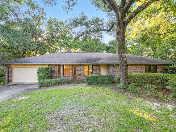 One owner and lovingly maintained, this home is 1794 sq ft of living space + a screened in porch and 2 car garage. It is situated on a .4 acre-lot in Niceville's Edgewater Village North. It features 2 bedrooms, 2 bathrooms & Den / family room / office or a 3rd bedroom. Freshly painted with hardwood floors and a functional floor plan. The afternoon sun lights up the Florida room and overlooks a private, wooded ravine. The kitchen with breakfast bar and dining area are at the heart of the home. Large master bedroom and bath with garden Whirlpool tub. Ample storage throughout! Indoor laundry room, HVAC 2019 and Roof 2017. Located minutes from Rocky Bayou and zoned for top-rated Niceville schools. Truly a lovely home!